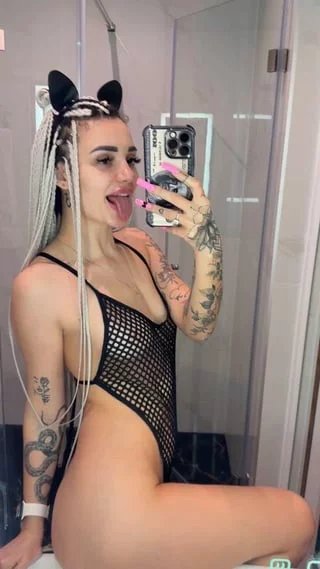 Feline fine in my fishnet bodysuit and cat ears